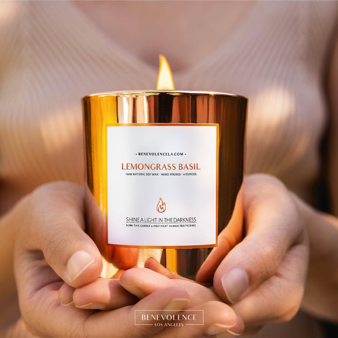 image of Gold Lit Lemongrass Basil Signature Candle in hand