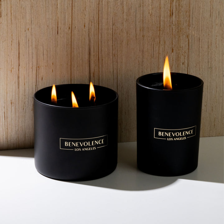 image of 2 black wax candles lit